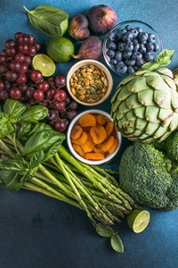 Variety of fresh raw organic fruits and vegetables.  Health food